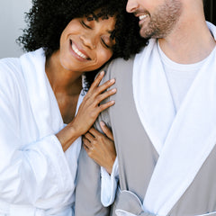 couple in plush bathrobes white and graphite